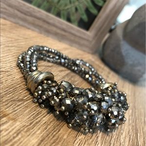 • Buy 1, get 1 FREE • Crystals & gold bracelet